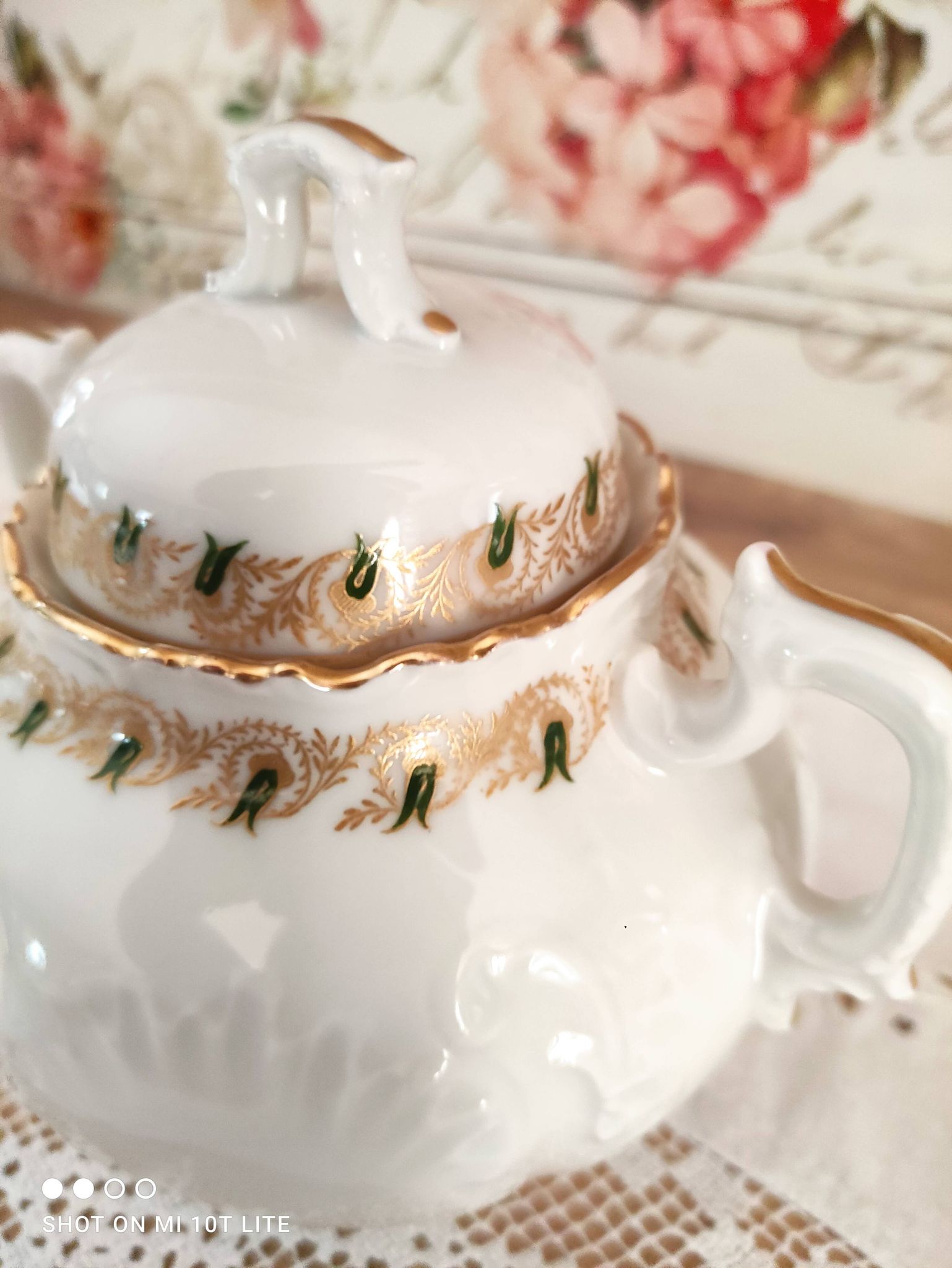 White porcelain sugar bowl decoration in relief and green and gold frieze