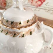 White porcelain sugar bowl decoration in relief and green and gold frieze