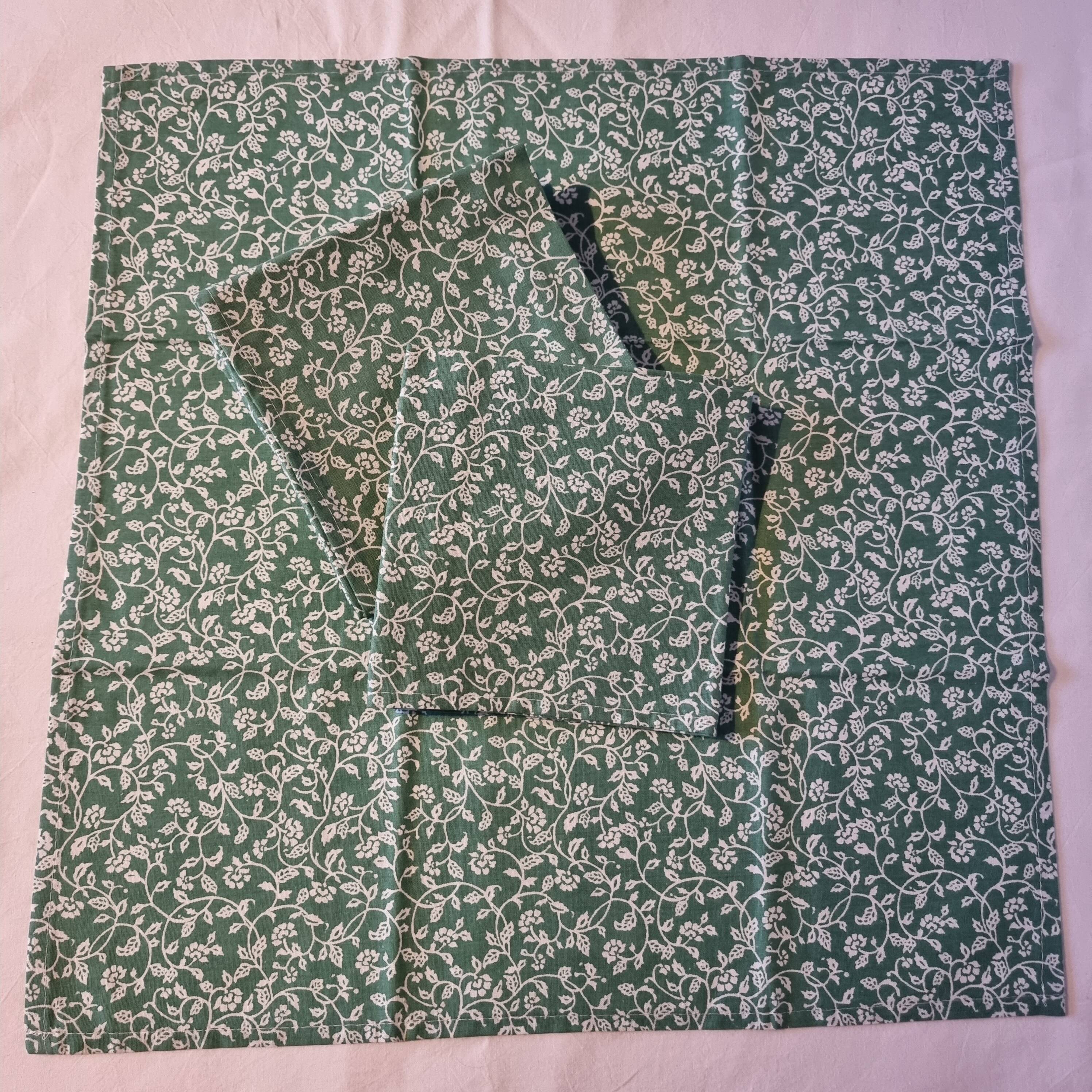 6 green cotton cloth napkins with white linens