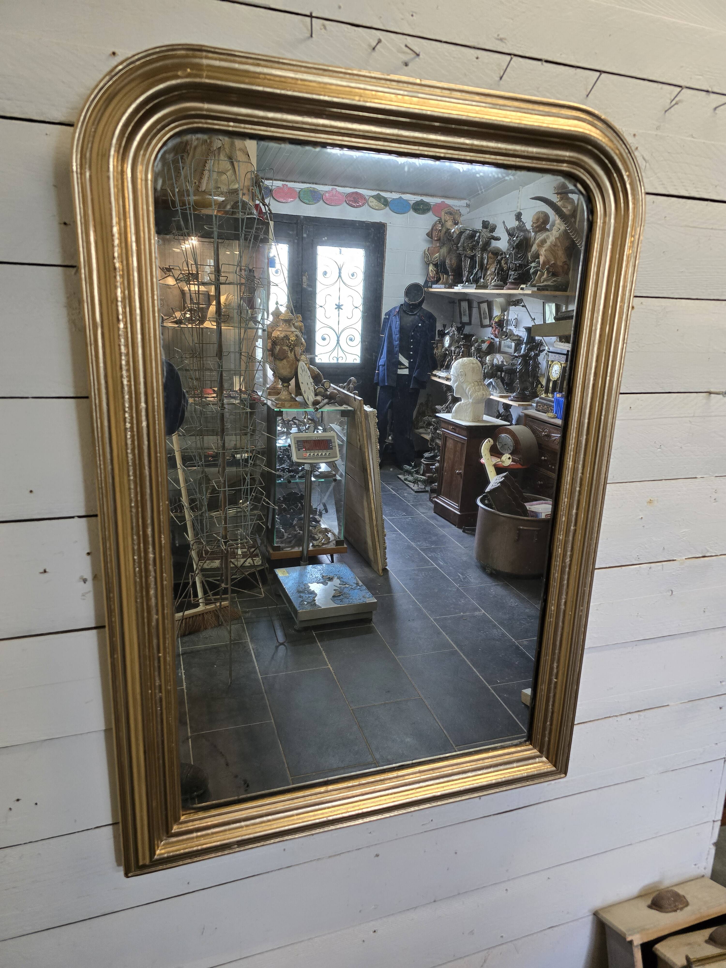 Old Louis Philippe style gilded mirror with mercury mirror