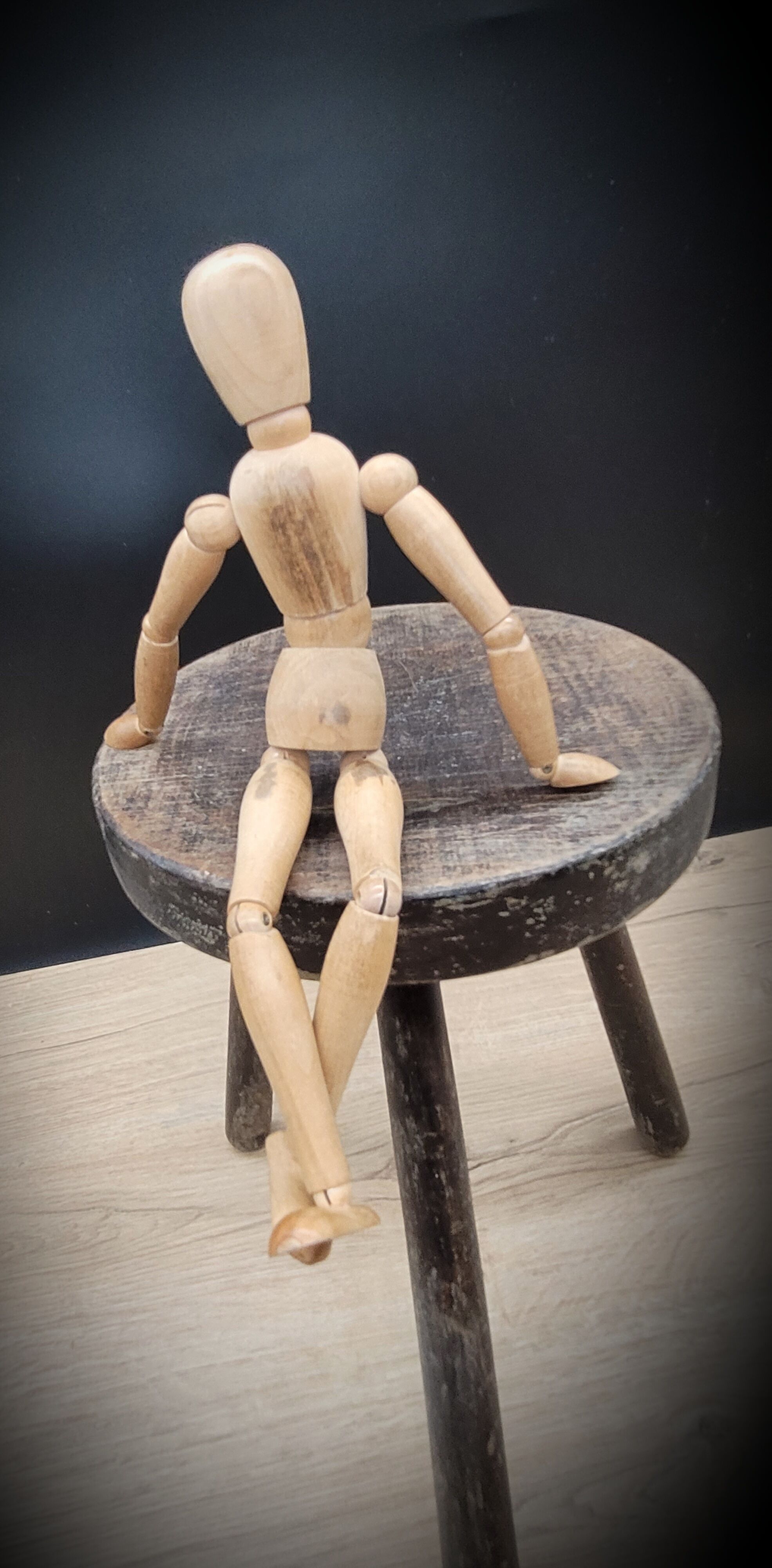 Massive black tripod stool