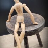 Massive black tripod stool