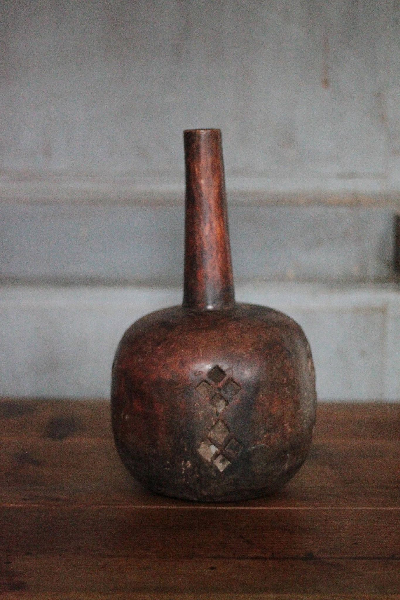 Vintage African wooden carved gourd bottle.