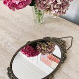 Miroir ovale en laiton doré