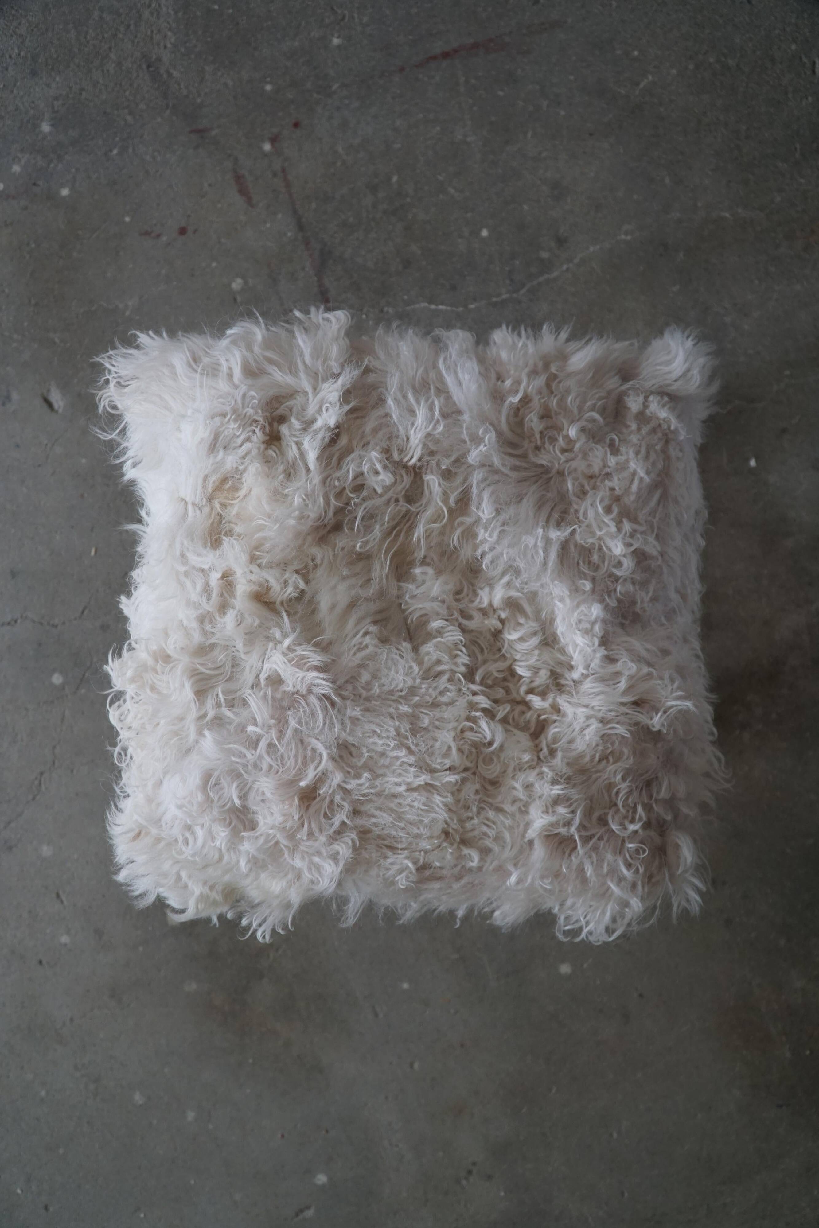 High oak stool, reupholstered in lambswool, Danish cabinetmaker, 1950s.