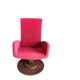Old cinema chair with a red reclining seat.