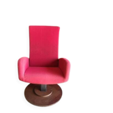 Old cinema chair with a red reclining seat.