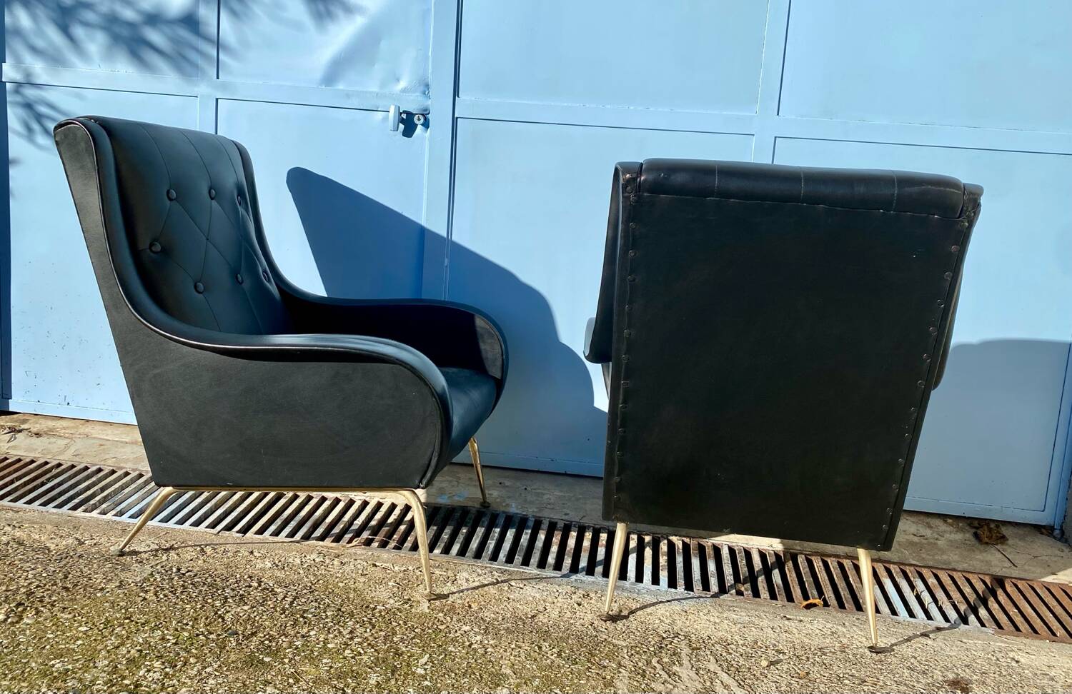 2 vintage faux leather armchairs