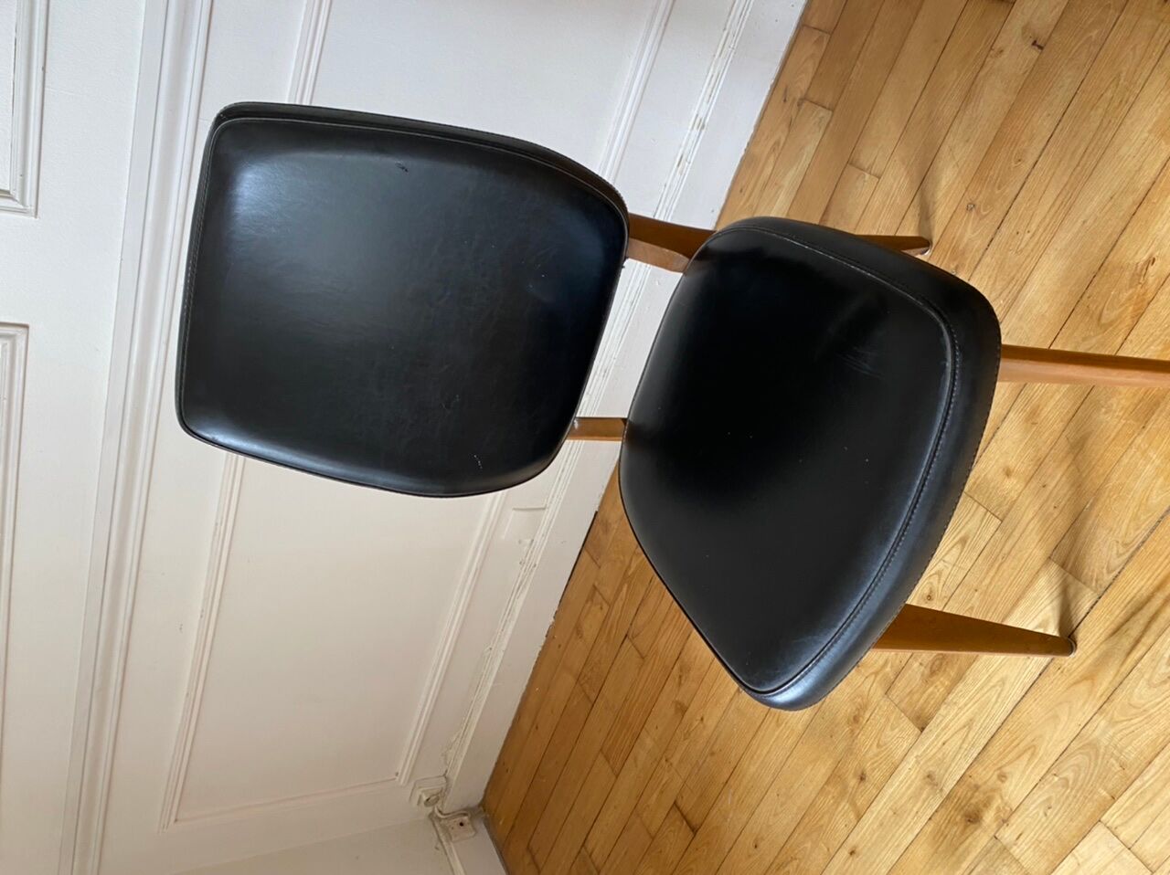 Pair of vintage wood and leather chairs