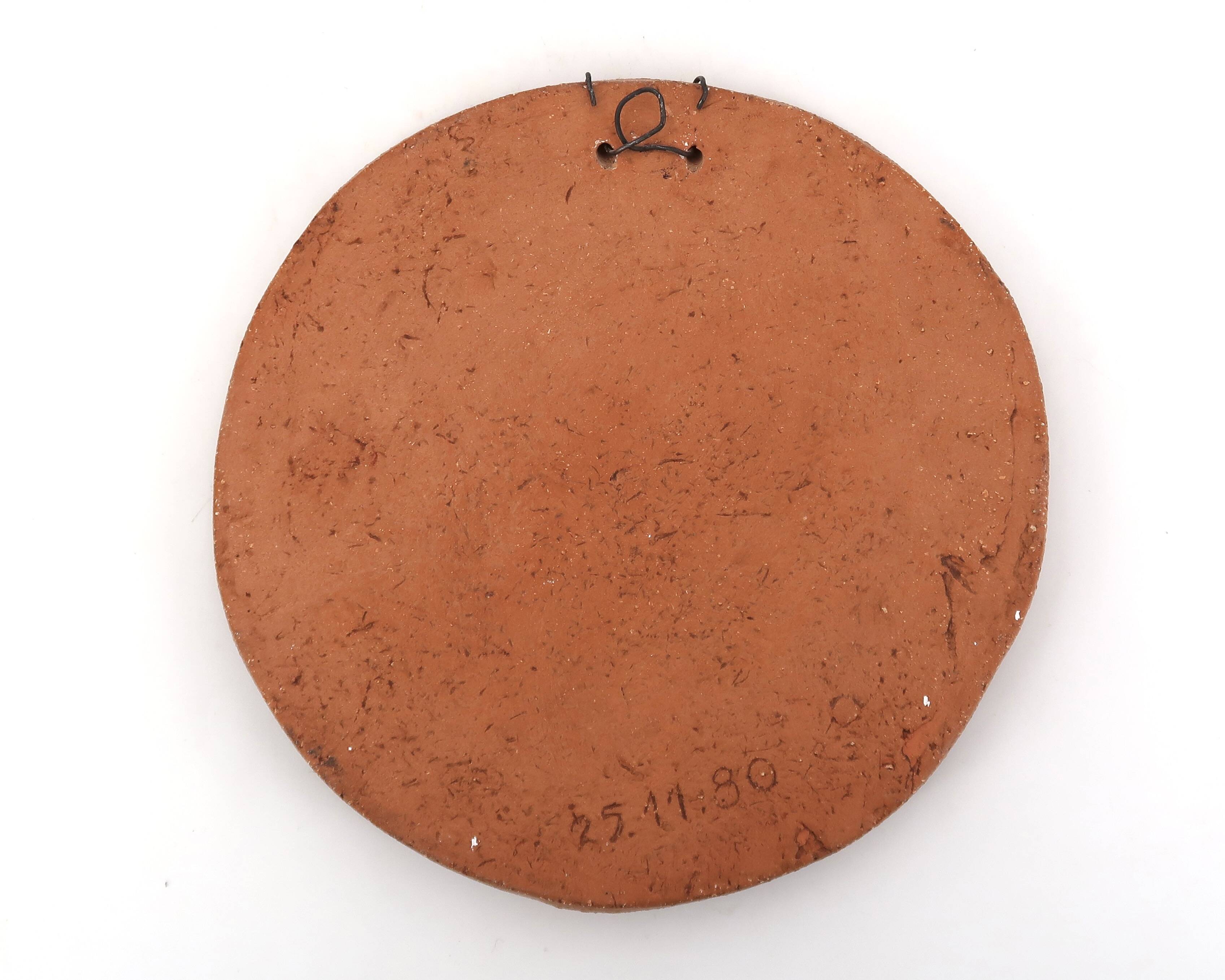 Round ceramic wall mask inspired by Africa, 1980s.