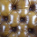 Pair of padded Chesterfield armchairs