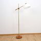 Floor lamp with a swivelling arm
