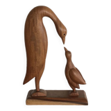 Sculpture of a goose feeding its young