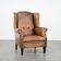 Large and comfortable sheepskin leather wingback chair with black piping