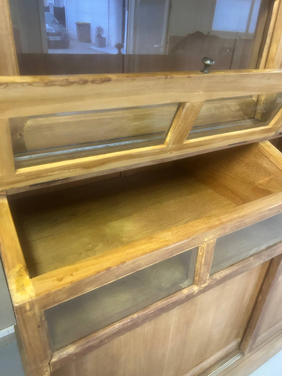 Large antique haberdashery cabinet with glass doors.