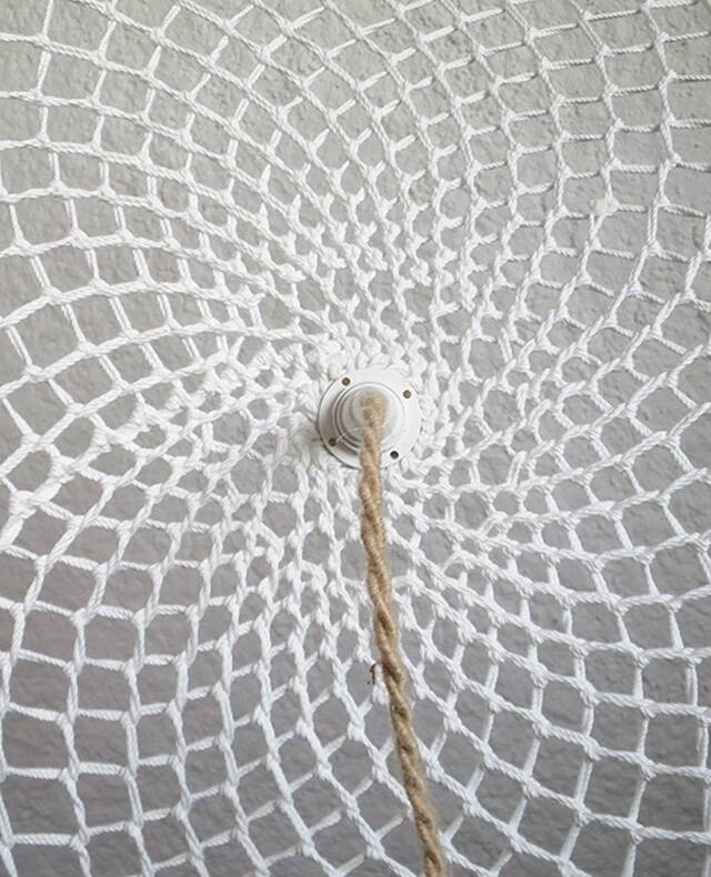 Curved rattan and rope pendant light