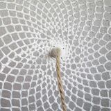 Curved rattan and rope pendant light