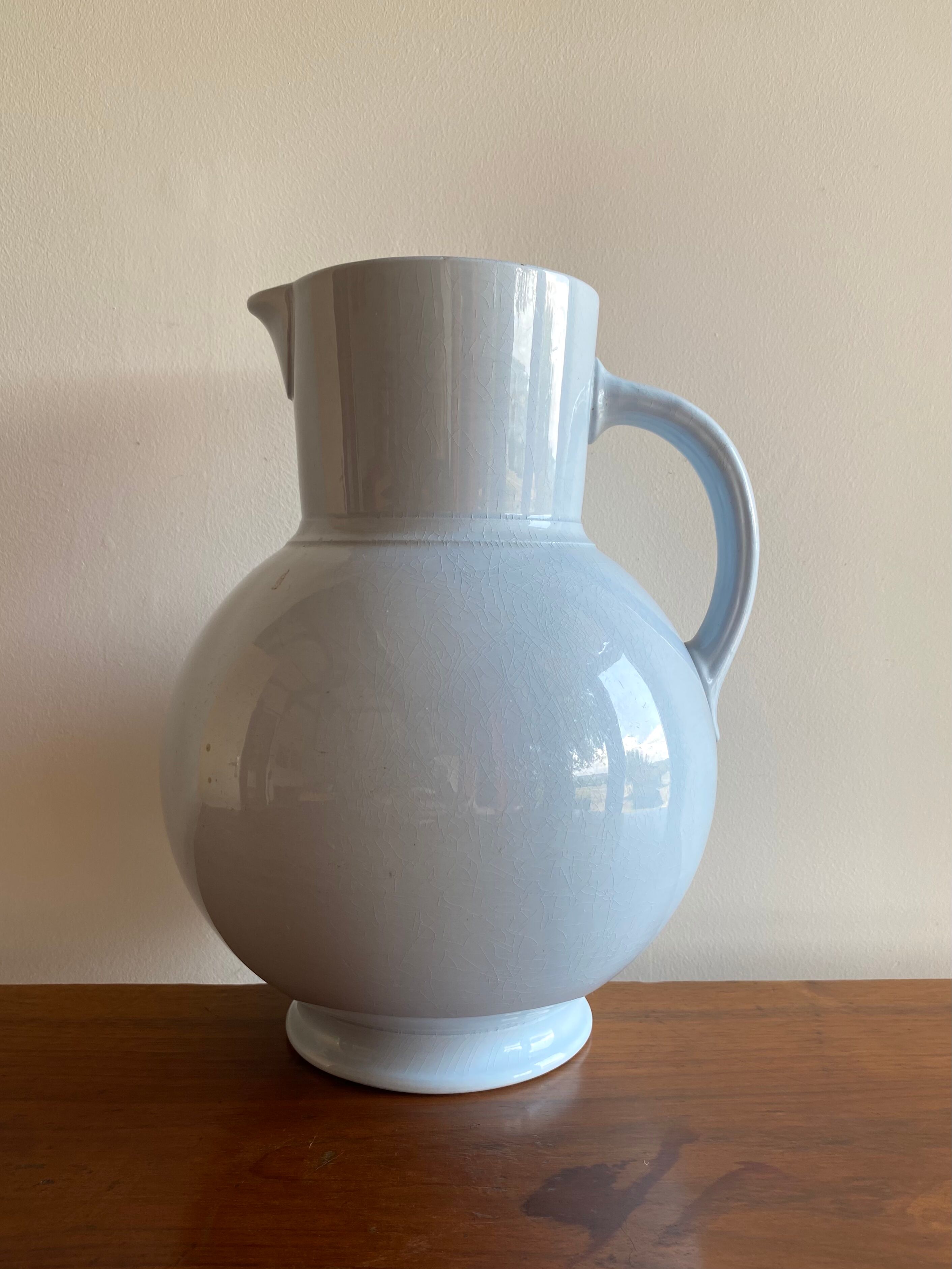 Antique vase in pale blue ceramic