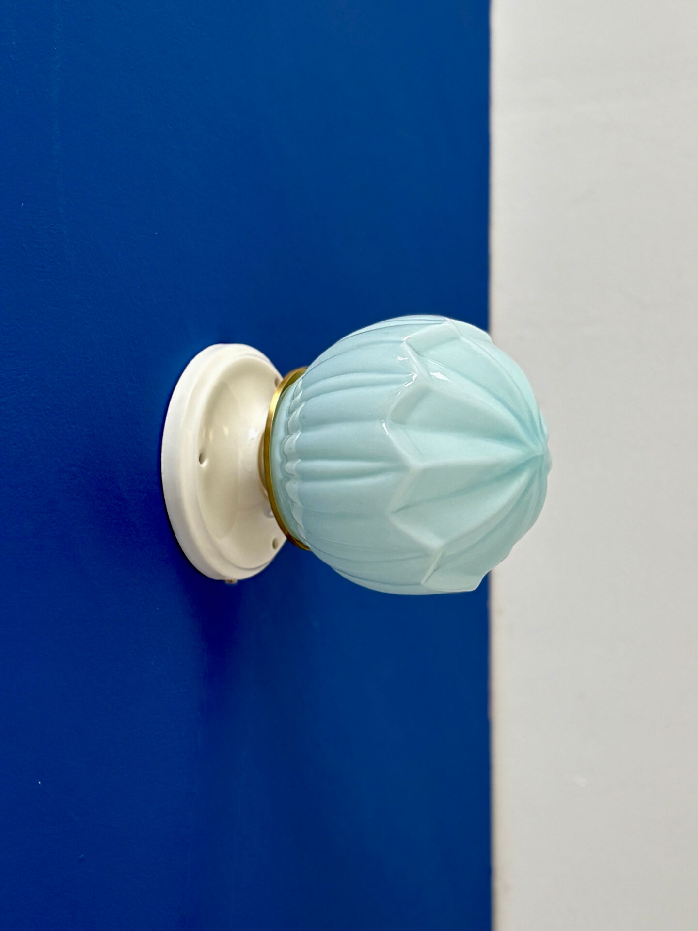 Vintage Art Deco globe wall light in blue opaline.