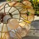 Suspension nacre et laiton papillons