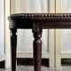 Dark wood piano bench