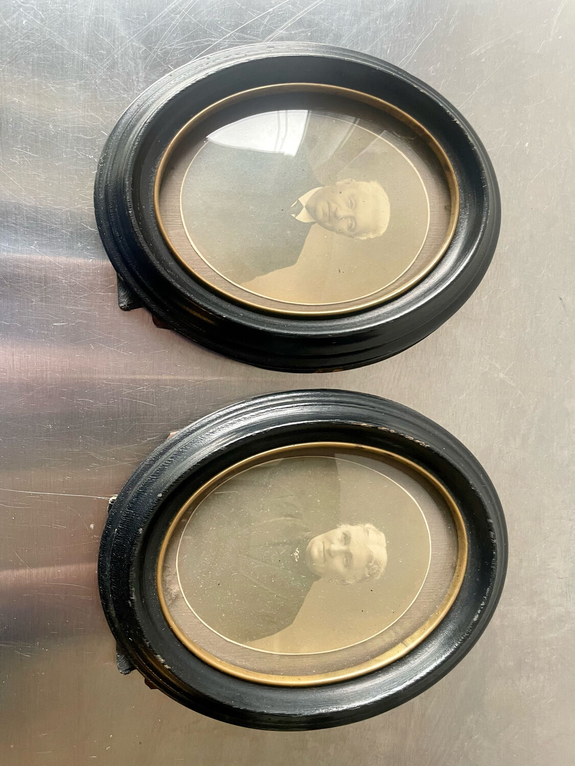 Antique pair of black wooden oval frames each 16.5 cm x 13 cm