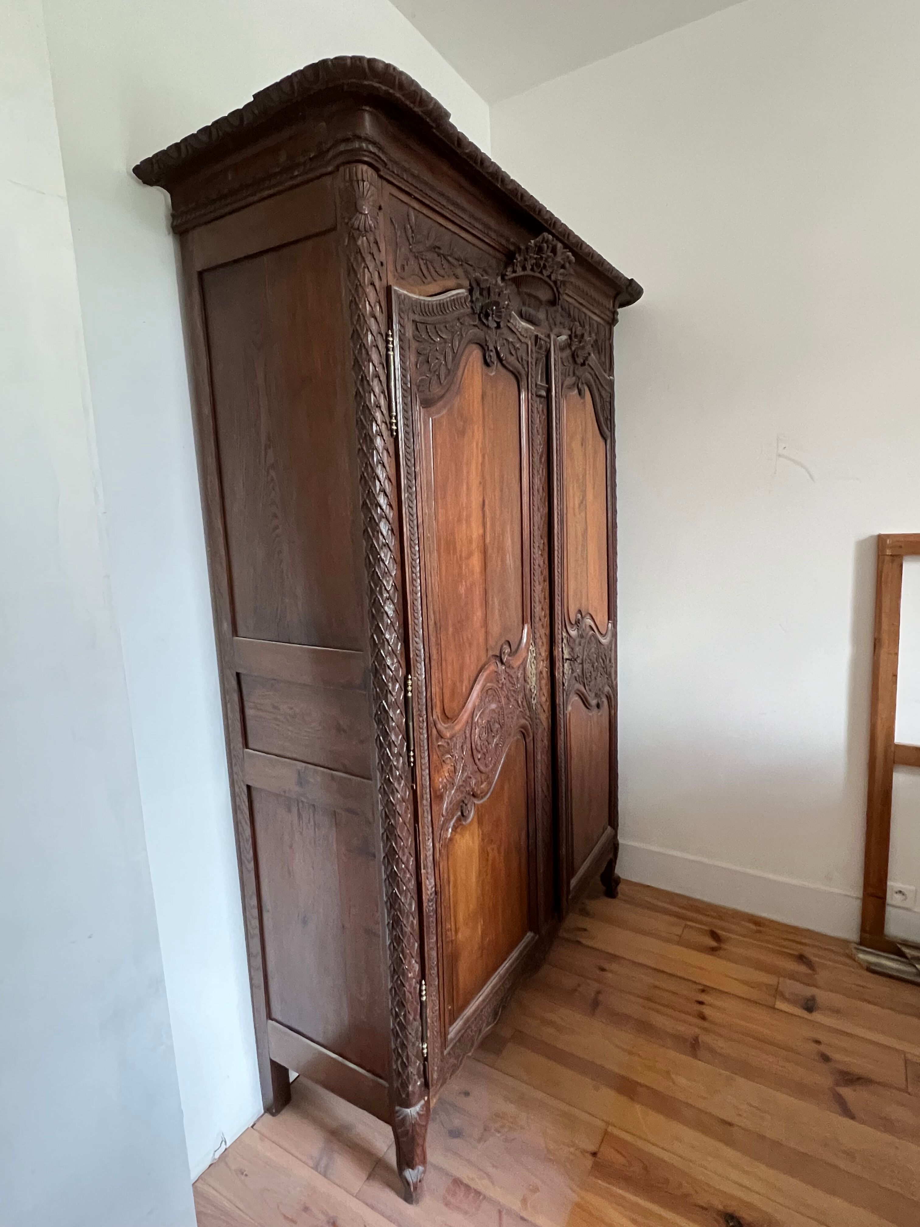 Beautiful and ancient Norman wedding wardrobe, richly carved