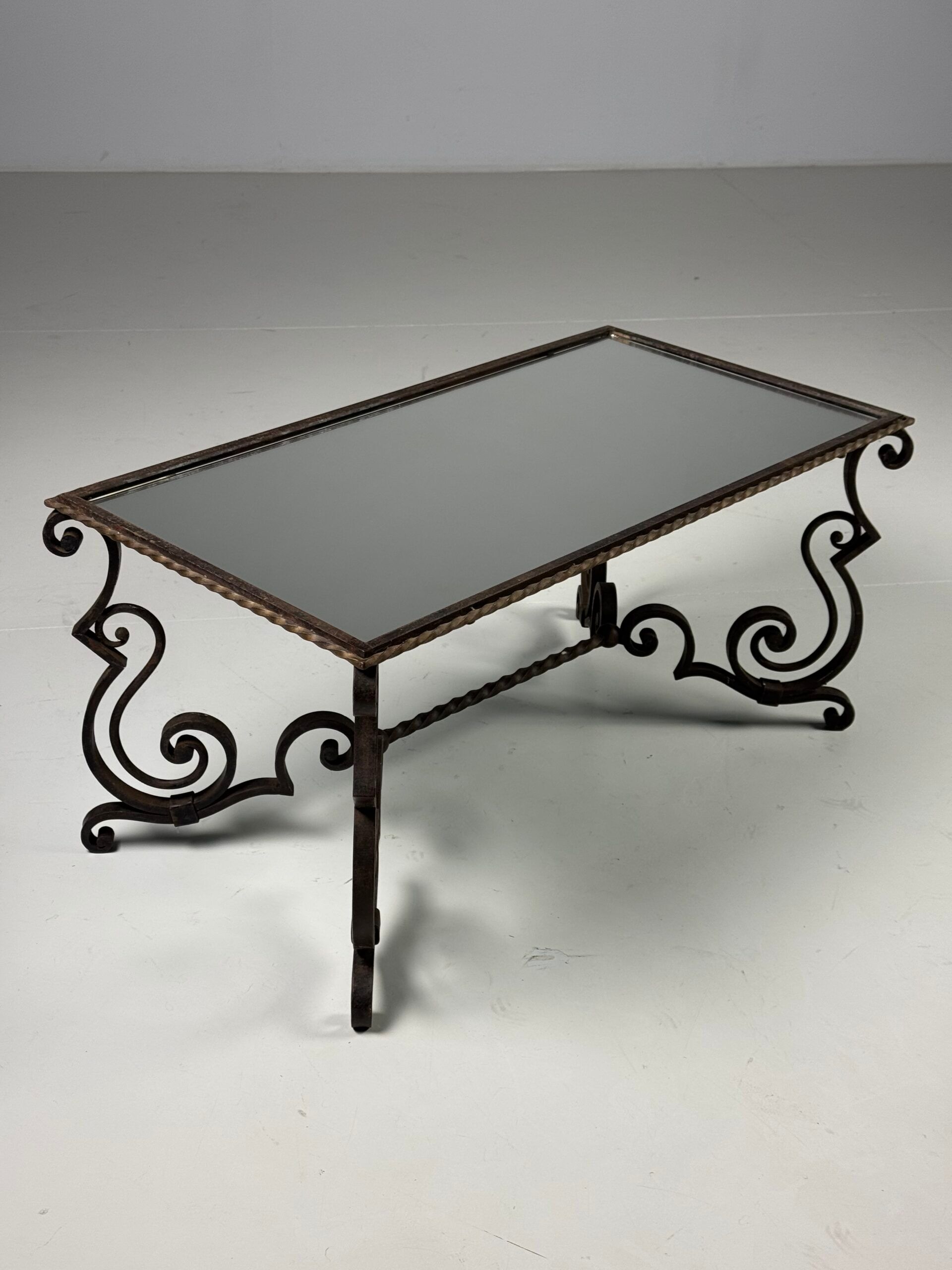 Wrought iron coffee table with mirror glass
