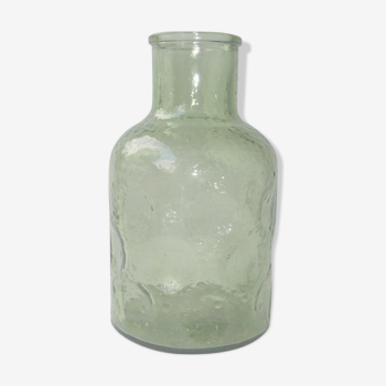 Vintage bottle in green bubbled glass