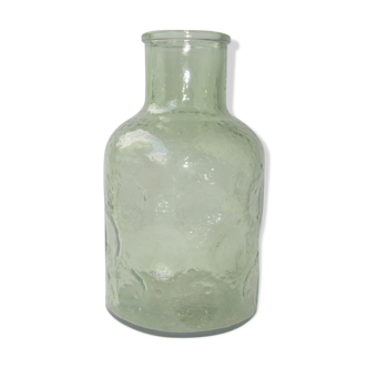 Vintage bottle in green bubbled glass