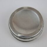 Small round box with silver pills