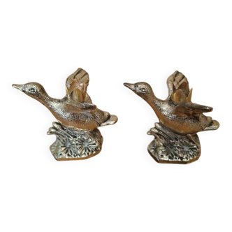 Set of two antique silver-plated duck candlesticks.
