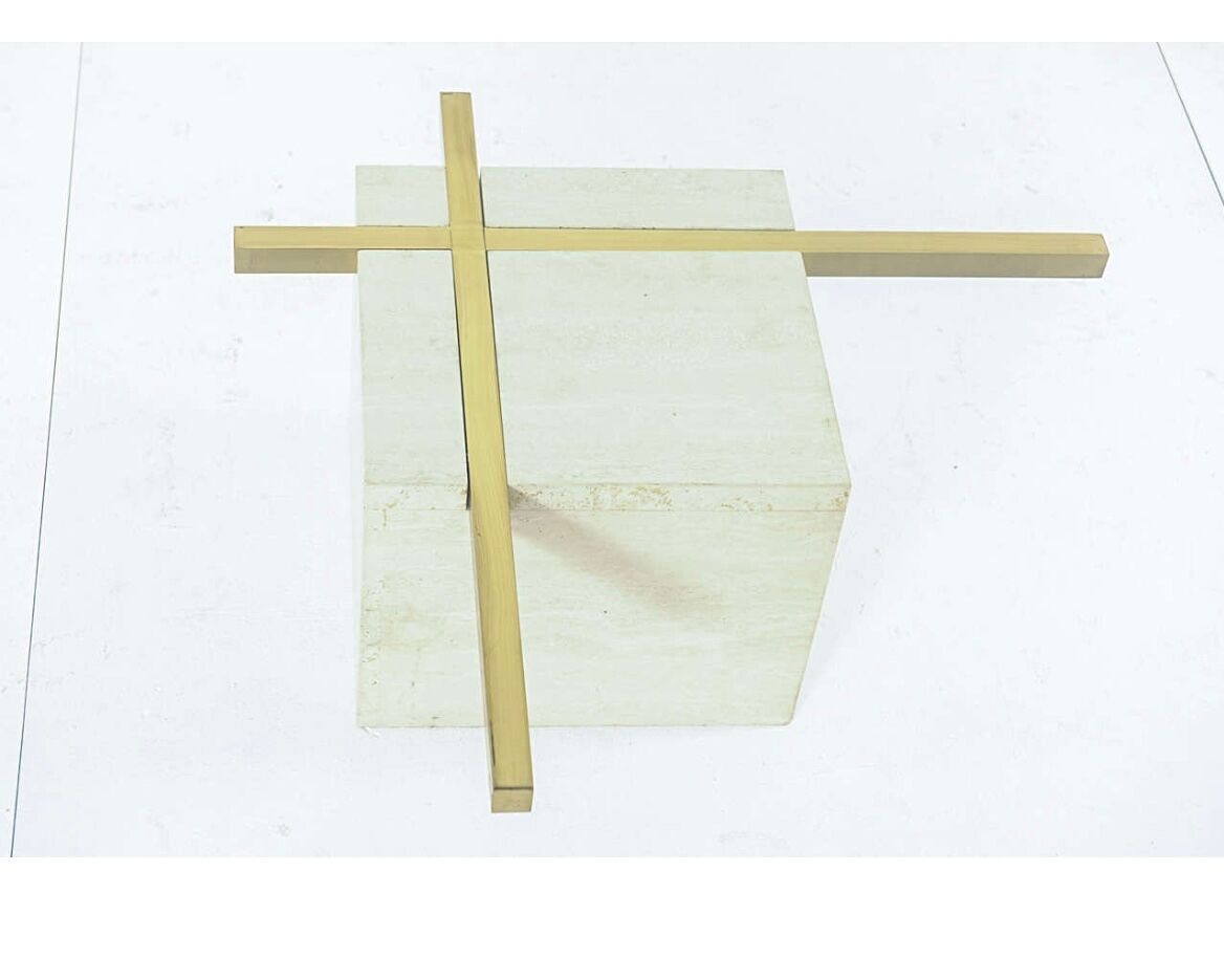 Coffee table with travertine gold-plated cross base and glass top