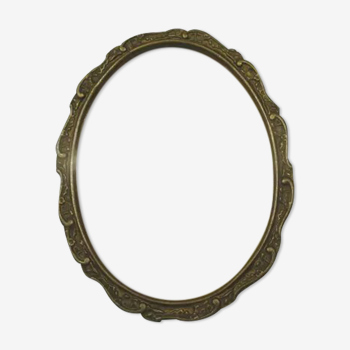 Old wall frame in carved wood and gilded stucco, oval