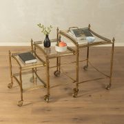 Set of 3 vintage Hollywood Regency nesting tables with brass frame and glass tops (1960s)