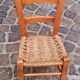 Small chair for children, folk art, wood and straw.