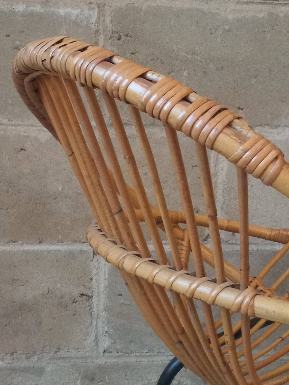 Rattan armchair with metal base from the 1950s