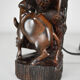 African carved ebony lamp, "Hunters, buffalo and crocodile"