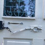 Entrance door in solid oak, cast iron grille, 1930s