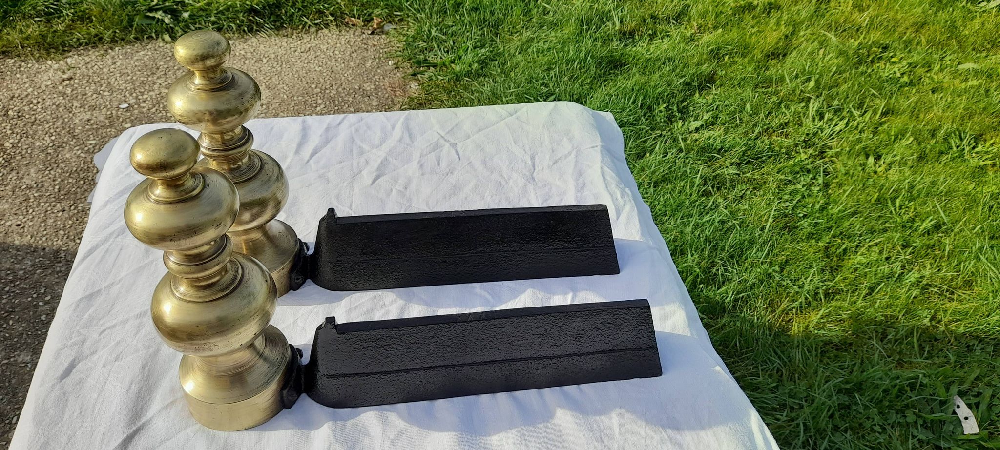 Pair of andirons in black metal and golden balls