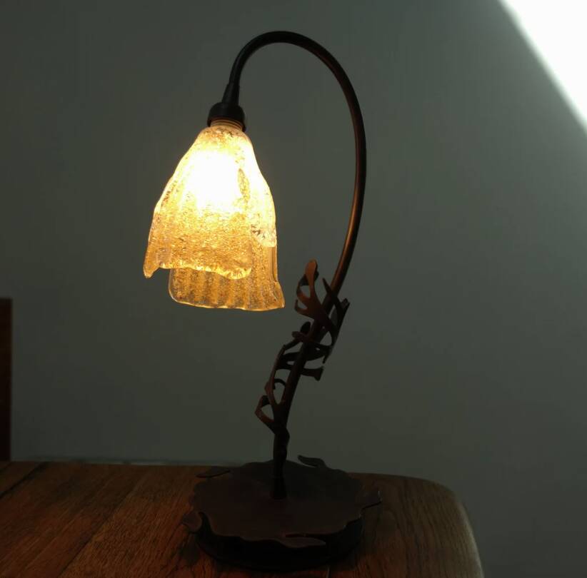 Art Deco lamp in wrought iron and blown glass.