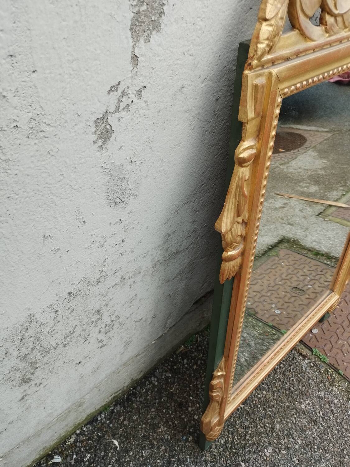 Antique gilded wooden mirror in Louis XVI style