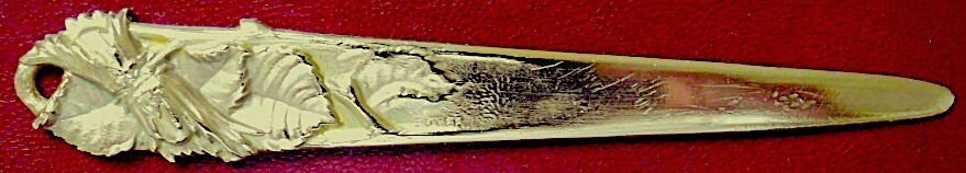 Bronze paper cutter decorated with trendy hazelnuts