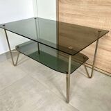 1975 glass coffee table with 2 tops, good condition