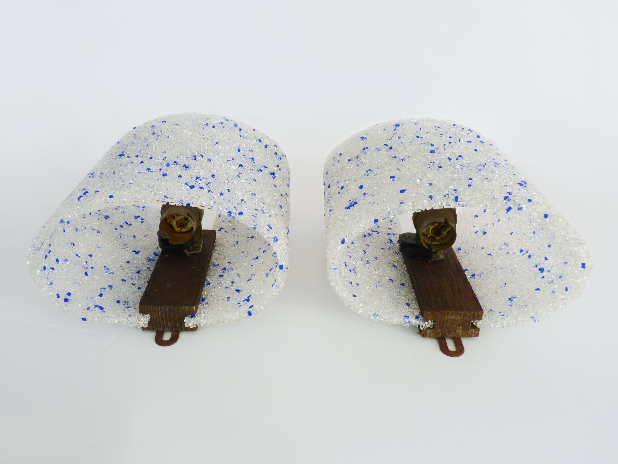 Pair of vintage wall sconces in transparent and wavy blue perspex. Year 60