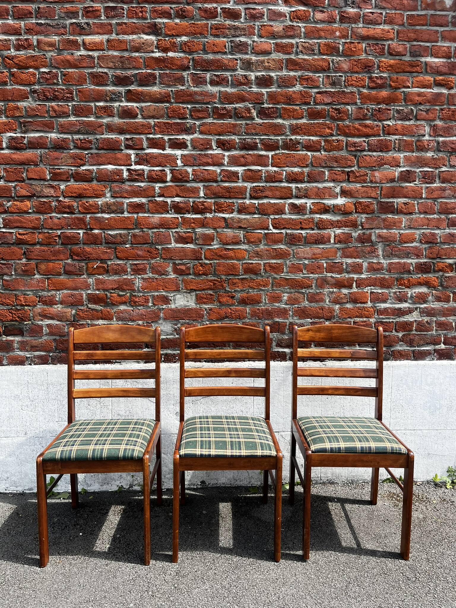 Lot of 3 vintage checkered wood and fabric chairs.