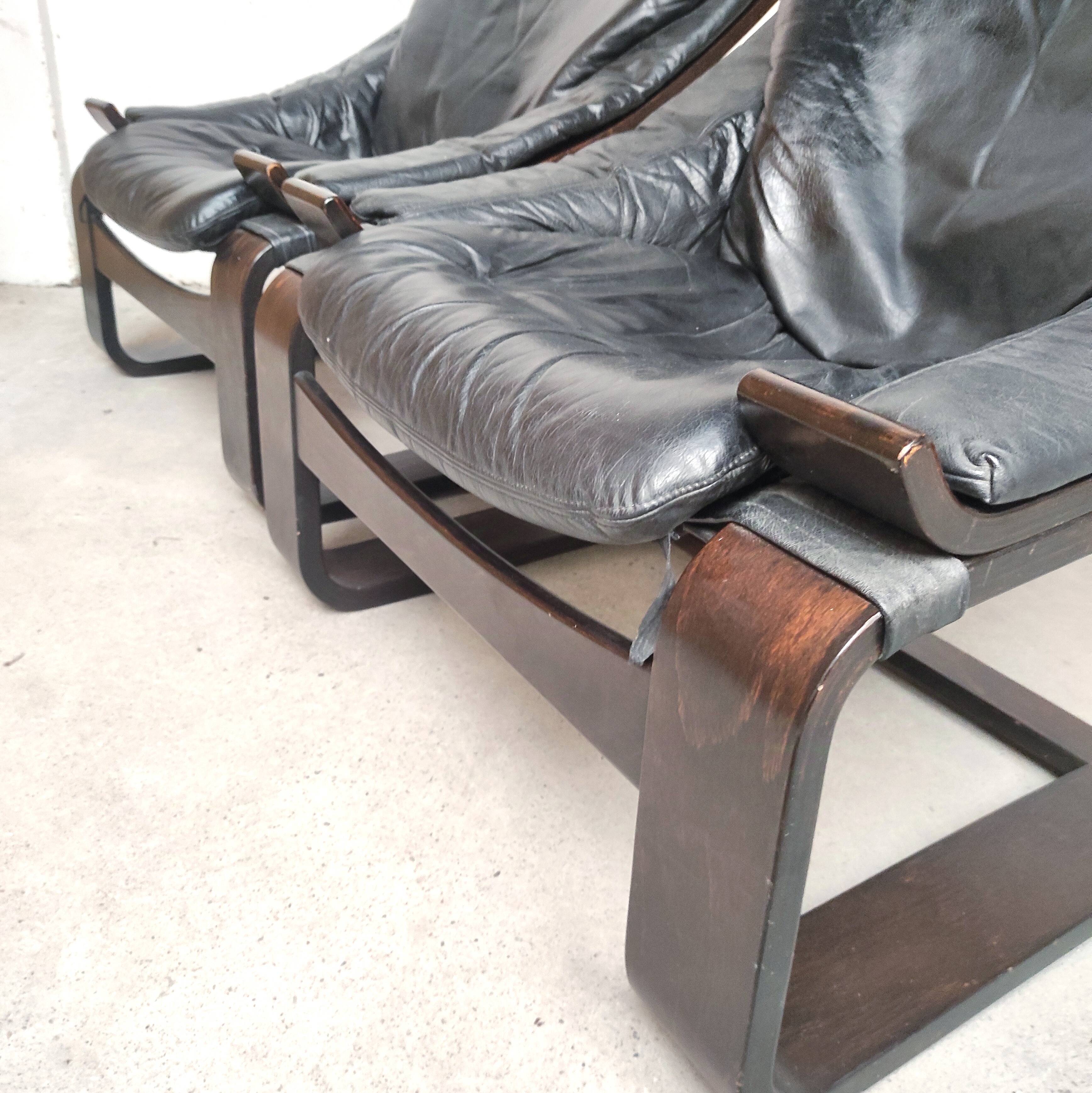 Pair of Kroken armchairs in black leather