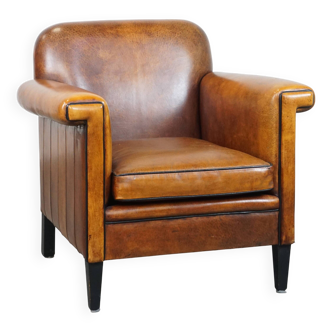 Sheep leather Art Deco design armchair finished with black piping