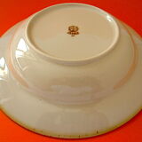 Suite of twelve speckled sandstone soup plates