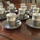 Un lot de 13 tasses à moka soucoupe et porte tasse en étain intérieur tasse en porcelaine de limoges avec décor de filte gris